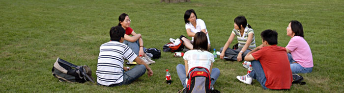 International students talk while sitting in a circle