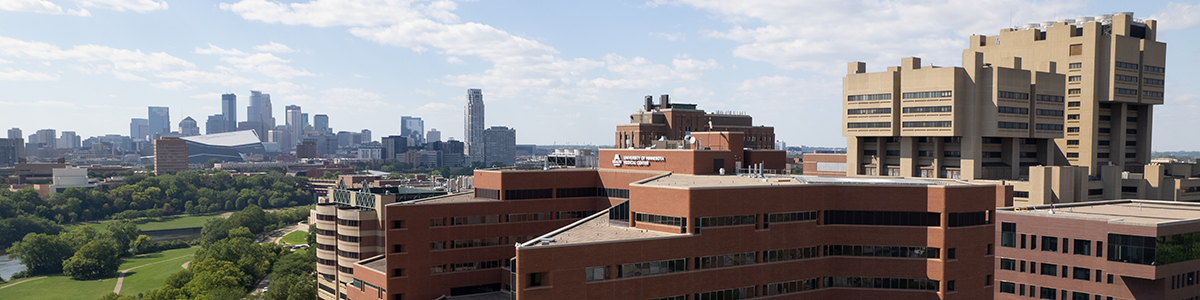 photo of UMN health science buildings with downtown Minneapolis in background